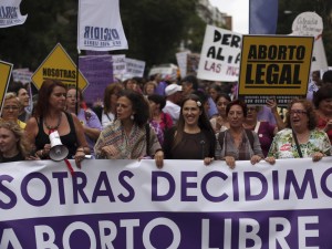 Demonstrators shout slogans during pro-choice protest against government's proposed new abortion law in Madrid